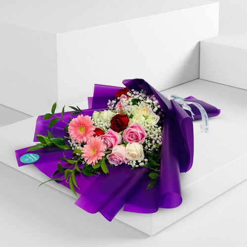 purple wrapped mixed flower bouquet