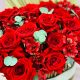 red flower arrangement in customized wooden box