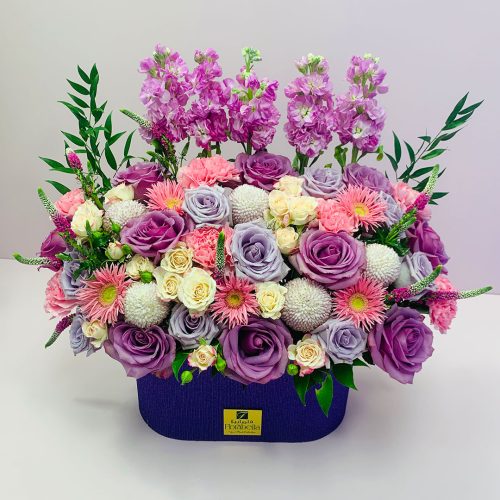 purple flower arrangement box