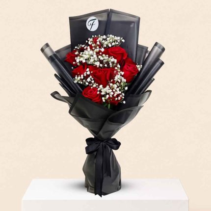 10 fresh red roses hand bouquet with elegant wrapping available for QAR 99 from Florabella Flowers Qatar with same day flower delivery in Doha and across Qatar.