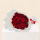 Luxury bouquet of 20 fresh red roses beautifully wrapped in elegant white paper for romantic occasions with same-day flower delivery in Doha, Qatar.