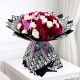 Luxury bouquet of 50 fresh white and red roses beautifully wrapped in premium paper for birthdays, anniversaries, weddings, Valentine's Day and same-day flower delivery across Doha, Qatar.