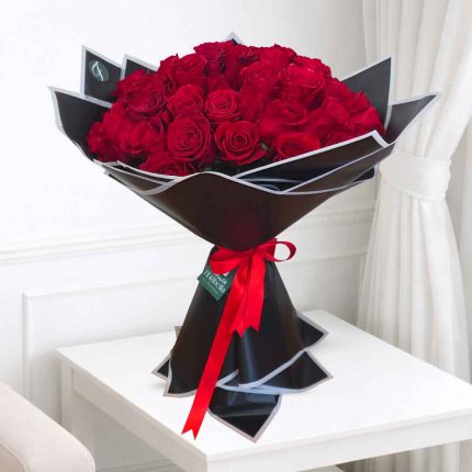 Elegant 50 Red Roses Bouquet handcrafted with premium fresh red roses for anniversaries, proposals, birthdays, Valentine's Day, and romantic celebrations in Qatar.