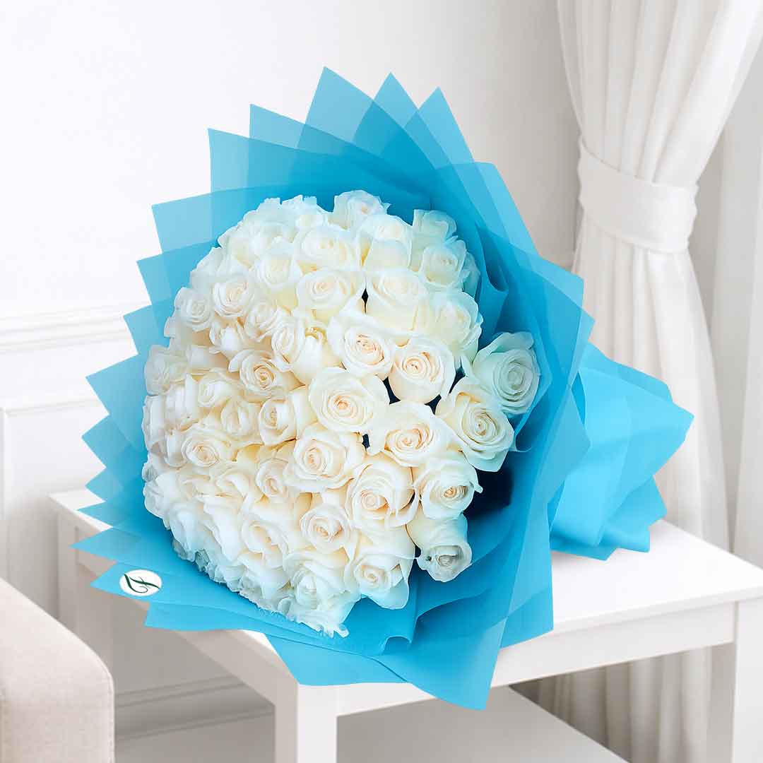 Luxury White Roses Bouquet in Elegant Blue Wrapping Fresh luxury white roses bouquet beautifully wrapped in elegant blue premium wrapping for birthdays, anniversaries, weddings, and same-day flower delivery in Qatar.
