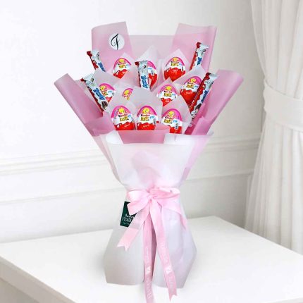 Luxury Kinder Joy bouquet for girls featuring original Kinder Joy chocolates in elegant pink gift wrapping, perfect for birthdays, Children's Day, and same-day delivery in Doha, Qatar.