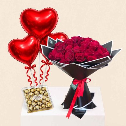 Luxury 50 red roses bouquet with heart-shaped foil balloon and Ferrero Rocher chocolates, perfect for birthdays, anniversaries, Valentine's Day, romantic surprises, and special occasions. Same-day flower delivery in Doha, Qatar by Florabella Flowers.