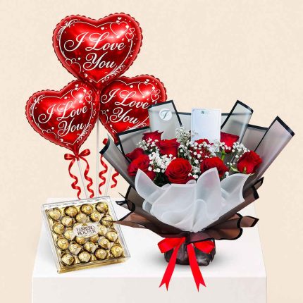 Luxury red roses bouquet with I Love You heart foil balloon and Ferrero Rocher chocolates gift combo for romantic occasions, same-day flower delivery in Doha, Qatar by Florabella Flowers.