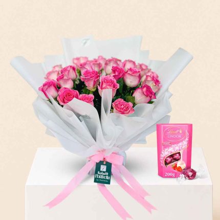 Fresh pink roses bouquet paired with premium Lindor chocolates, luxury flower and chocolate gift combo with same-day delivery in Doha, Qatar by Florabella Flowers.