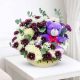 Luxury teddy bear and fresh flower arrangement in a woven basket, perfect gift combo for birthdays, anniversaries, love, congratulations, and special occasions with same-day flower delivery in Qatar by Florabella Flowers