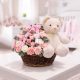 Luxury teddy bear and fresh flower arrangement in a woven basket, perfect gift combo for birthdays, anniversaries, love, congratulations, and special occasions with same-day flower delivery in Qatar by Florabella Flower