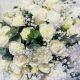 Elegant white rose arrangement in a clear glass vase featuring fresh premium white roses for luxury flower delivery in Qatar