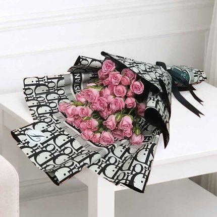 Luxury pink baby rose bouquet made with fresh pink spray roses, beautifully wrapped for birthdays, anniversaries, Mother's Day, Valentine's Day, and same-day flower delivery in Doha, Qatar.