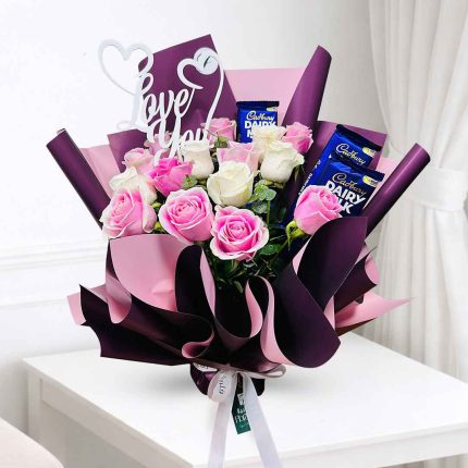 Luxury Pink and White Roses with Dairy Milk Chocolate Bouquet beautifully wrapped for birthdays, anniversaries, Valentine's Day, Mother's Day and romantic occasions with same day flower delivery in Doha, Qatar.