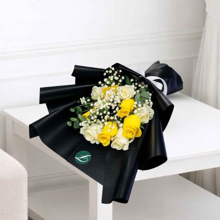 Fresh yellow and white roses bouquet beautifully arranged in luxury black wrapping, perfect for birthdays, congratulations, graduations, and same-day flower delivery across Doha and Qatar.
