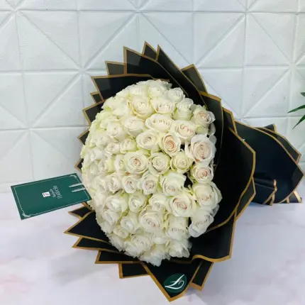100 white roses bouquet in elegant luxury wrapping for flower delivery in Qatar