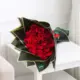 25 red roses bouquet with elegant black and golden border wrapping, luxury flower delivery in Qatar