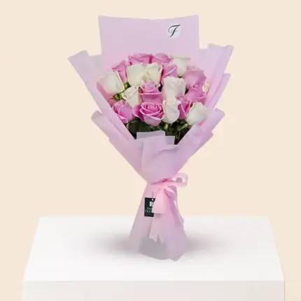 Pink and white mixed roses bouquet with fresh roses, elegant wrapping and floral arrangement in Qatar