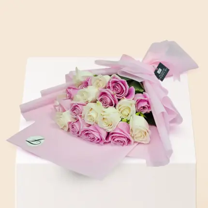 Pink and white mixed roses bouquet with fresh roses, elegant wrapping and floral arrangement in Qatar