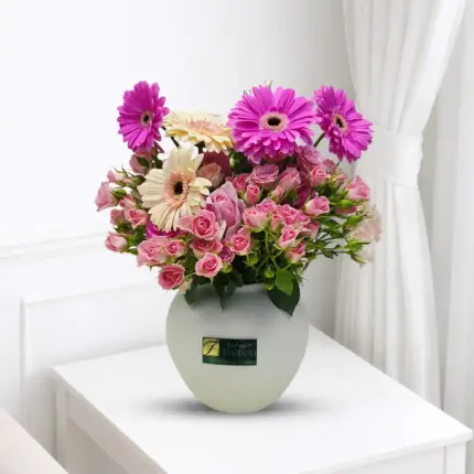 Gerbera and baby roses mixed vase with elegant pink flowers in Qatar