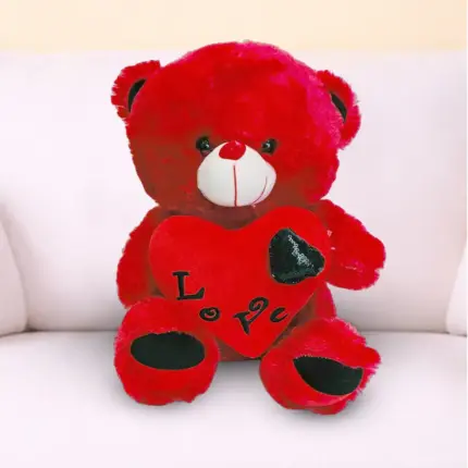 Red soft toy teddy bear with Love You printed message, romantic gift available at Florabella Flowers Qatar